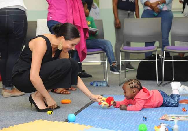 Britain's Meghan Duchess of Sussex visits the Mothers2Mothers organisation, which trains and employs women living with HIV as frontline health workers across eight African nations, in Cape Town, South Africa, Wednesday, Sept. 25, 2019. The royal couple Prince Harry and Meghan are on the third day of their African tour. [Photo: AP/ Henk Kruger / African News Agency Pool]