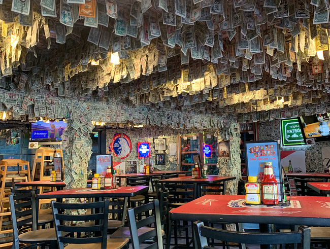 File photo: Dollar bills hang everywhere at the Siesta Key Oyster Bar. [Photo from Instagram account of Siesta Key Oyster Bar]