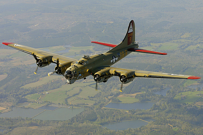 In this April 2, 2002, file photo, the Nine-O-Nine, a Collings Foundation B-17 Flying Fortress, flies over Thomasville, Ala., during its journey from Decatur, Ala., to Mobile, Ala. [Photo: AP/John David Mercer/Press-Register]