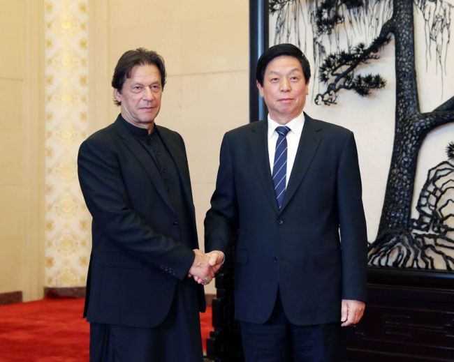 Li Zhanshu, chairman of the Standing Committee of the National People's Congress (NPC), meets with Pakistani Prime Minister Imran Khan at the Great Hall of the People in Beijing, Oct. 9, 2019. [Photo: Xinhua/Liu Weibing]