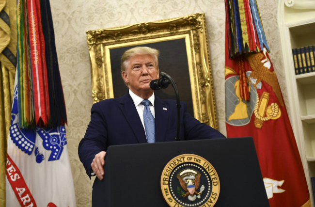 U.S. President Donald Trump speaks before awarding the Medal of Freedom to former Attorney General Edwin Meese during a ceremony in the Oval Office at the White House in Washington, DC on October 8, 2019. [Photo: AFP/Brendan Smialowski]
