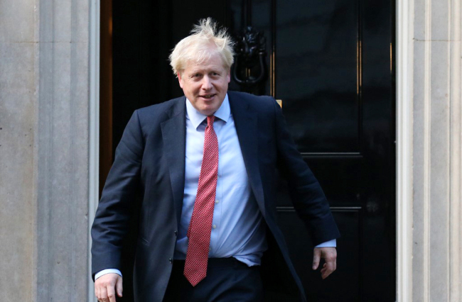 Britain's Prime Minister Boris Johnson gestures as he prepares to welcome European Parliament president David Sassoli to 10 Downing Street for a meeting in London on October 8, 2019. [Photo: AFP]