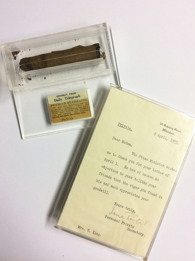 The Churchill cigar, the letter from 10 Downing Street, and a newspaper cutting relating to the night it was found, on display at Hansons. [Photo: VCG]