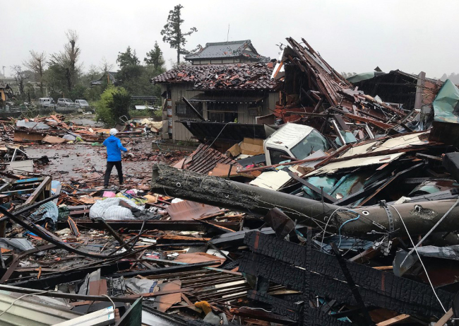 Damaged houses caused by weather patterns from Typhoon Hagibis are seen in Ichihara, Chiba prefecture on October 12, 2019. [Photo: AFP]