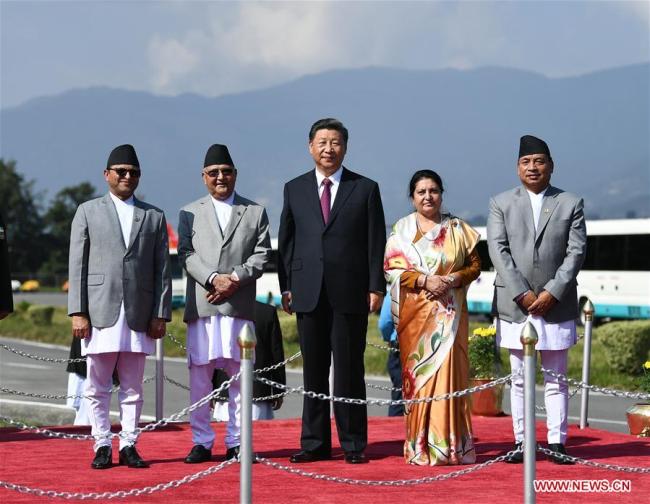 Nepali President Bidya Devi Bhandari hosts a grand farewell ceremony for Chinese President Xi Jinping at the airport in Kathmandu, Nepal, Oct. 13, 2019. Nepali Vice President Nanda Bahadur Pun, Prime Minister K.P. Sharma Oli, Chairman of the National Assembly Ganesh Prasad Timilsina, cabinet members and senior army generals also attended the ceremony. [Photo: Xinhua/Xie Huanchi]