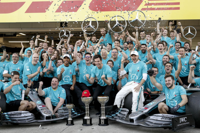 Lewis Hamilton, Valtteri Bottas and team principal Toto Wolff with rest of the Mercedes AMG Petronas Motorsport Team celebrate the win of Constructors Championship 2019 at the Suzuka Circuit in Japan on Oct 13, 2019. [Photo: IC]