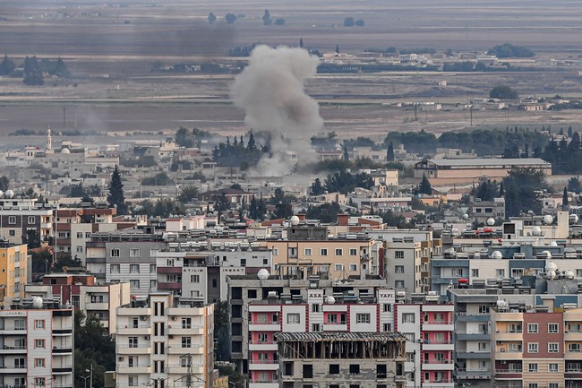 This picture taken on October 15, 2019 from the Turkish side of the border at Ceylanpinar district in Sanliurfa shows smoke rising from the Syrian town of Ras al-Ain. [Photo: AFP/ Ozan KOSE]