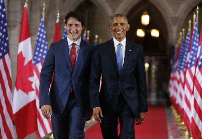 In this file photo taken on June 29, 2016 Prime Minister of Canada Justin Trudeau (L) and US President Barack Obama exit the Hall of Honour on Parliament Hill following the North American Leaders Summit in Ottawa. [Photo: AFP]