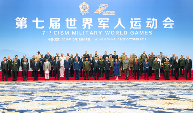 Chinese President Xi Jinping, also general secretary of the Communist Party of China (CPC) Central Committee and chairman of the Central Military Commission (CMC), poses for a group photo with leaders of the defense department and military of participating countries and officials of the International Military Sports Council (CISM) before the 7th Military World Games officially unveils in Wuhan, capital of central China's Hubei Province, on Oct. 18, 2019. [Photo: Xinhua/Li Gang]