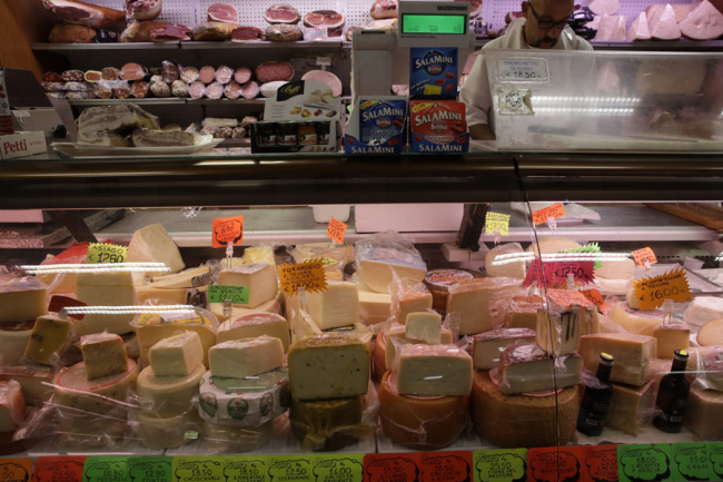 Blocks of Italian cheese are on sale in a deli in Rome, October 3, 2019. The Additional U.S. tariffs on a wide range of goods from the European Union (EU) took effect on October 18. They include EU cheeses, olives, and whiskey, as well as planes, helicopters and aircraft parts. [Photo: AP]