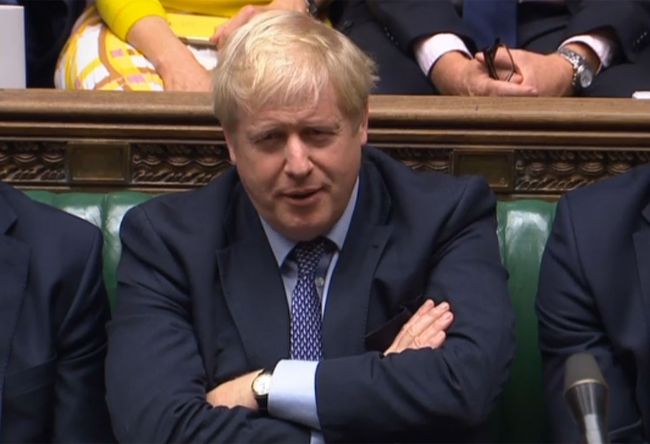 A video grab from footage broadcast by the UK Parliament's Parliamentary Recording Unit (PRU) shows Britain's Prime Minister Boris Johnson reacts as Britain's main opposition Labour Party leader Jeremy Corbyn speaks on a point of order after the House of Commons in London on October 19, 2019 voted to back an amendment in the name of former Conservative MP Oliver Letwin which delays the decision on the Brexit deal.[Photo: PRU/AFP via VCG] 