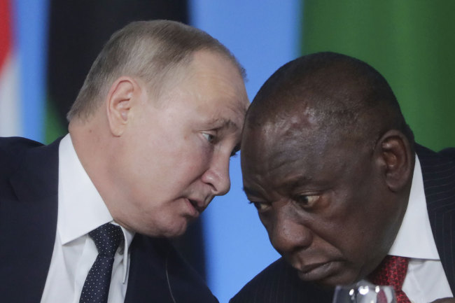 Russian President Vladimir Putin, left, talks with South African President, Cyril Ramaphosa during a plenary session at the Russia-Africa summit in the Black Sea resort of Sochi, Russia, Thursday, Oct. 24, 2019. [Photo: AP]