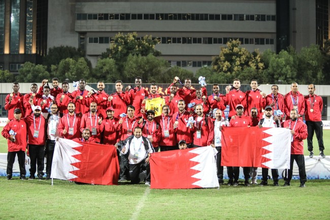Members of the Bahraini football team pose for photos after winning the gold medal at the Military World Games in Wuhan on Saturday, October 27, 2019. [Photo provided to China Plus]
