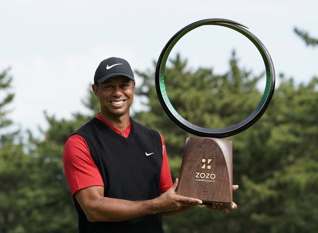 Tiger Woods of the United States poses with his trophy after winning the Zozo Championship PGA Tour at the Accordia Golf Narashino country club in Inzai, east of Tokyo, Japan, Monday, Oct. 28, 2019. [Photo: AP/Lee Jin-man]