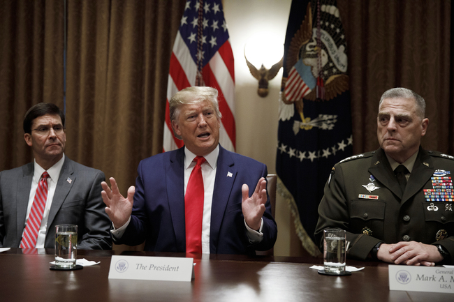 President Donald Trump, joined by from left, Defense Secretary Mark Esper, and Chairman of the Joint Chiefs of Staff Gen. Mark Milley, speaks to media during a briefing with senior military leaders in the Cabinet Room at the White House in Washington, Monday, Oct. 7, 2019. [Photo: AP/Carolyn Kaster]