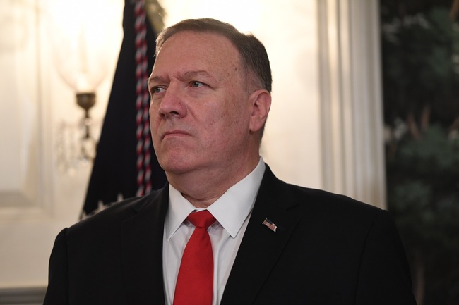 File Photo: U.S. Secretary of State Mike Pompeo listens as US President Donald Trump speaks about Syria in the Diplomatic Reception Room at the White House in Washington, DC, October 23, 2019. [Photo: AFP/SAUL LOEB] 