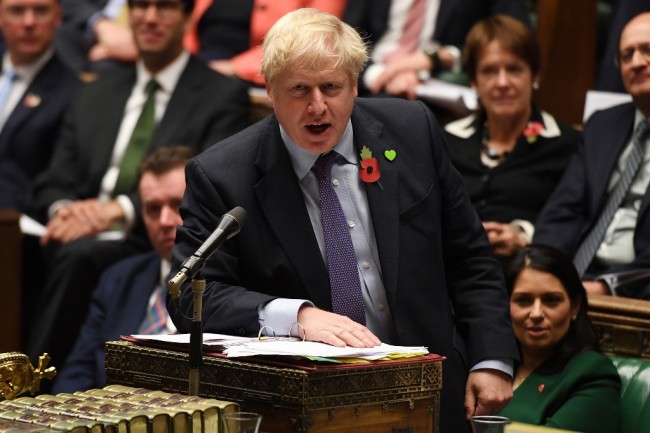 A handout picture released by the UK Parliament shows Britain's Prime Minister Boris Johnson speaking during the weekly Prime Minister's Questions (PMQs) in the House of Commons in London on October 30, 2019. [Photo: AFP]