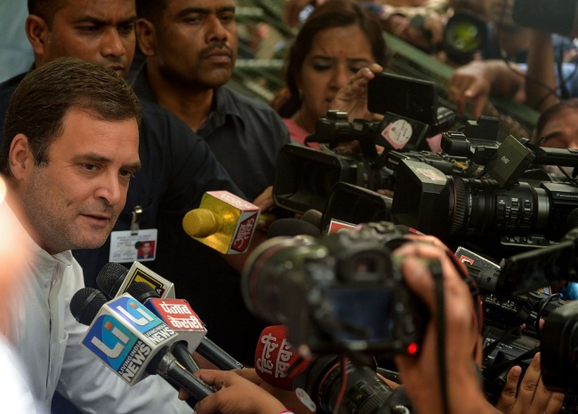 Indian National Congress president Rahul Gandhi speaks to the media after casting his vote at a polling station in New Delhi on May 12, 2019. [File Photo: VCG]