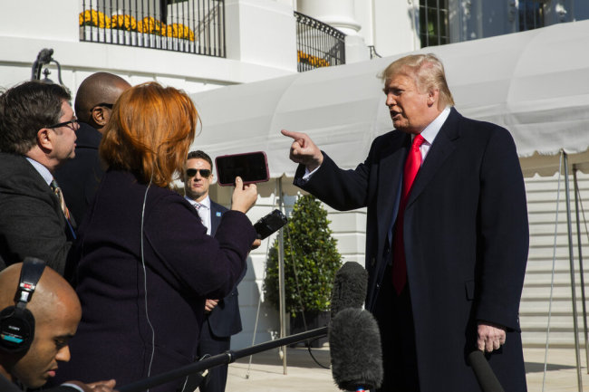 President Donald Trump speaks to reporters upon arrival at the White House in Washington, Sunday, Nov. 3, 2019. [Photo: AP]