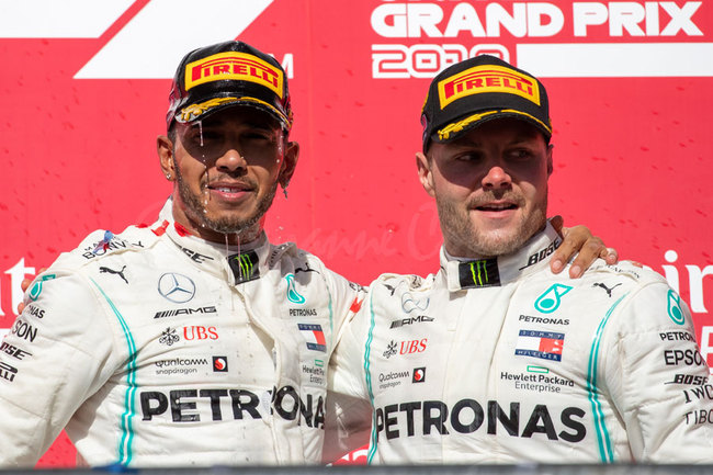 Lewis Hamilton (L) and Valtteri Bottas (R) of the Mercedes AMG Petronas F1 Team celebrate following the F1 Grand Prix of USA at Circuit of The Americas in Austin, Texas on November 03, 2019. [Photo: AFP/SUZANNE CORDEIRO]