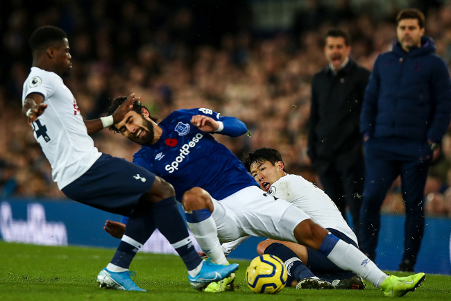Son Heung-min of Tottenham Hotspur tackles Andre Gomes of Everton which resulted in a red card and Gomes suffering an injury during the Premier League match between Everton FC and Tottenham Hotspur at Goodison Park on November 3, 2019 in Liverpool, United Kingdom. [Photo: Robbie Jay Barratt - AMA/Getty Editorial via VCG]