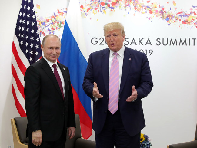 US President Donald Trump (R) attends a meeting with Russia's President Vladimir Putin during the G20 summit in Osaka on June 28, 2019. [File photo: Sputnik/AFP/Mikhail Klimentyev]