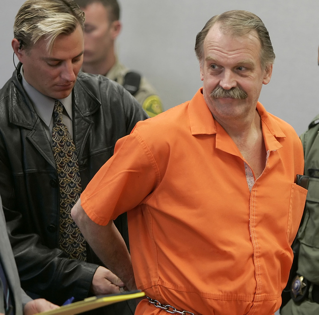 In this Oct. 6, 2005 file photo, convicted murderer and death row inmate Ron Lafferty is handcuffed after his court hearing in a courtroom in Provo, Utah. [Photo: AP]