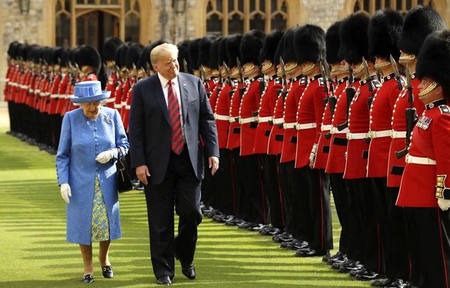 Britain's Queen Elizabeth II (L) and U.S. President Donald Trump (R) inspect the guard of honor formed of the Coldstream Guards during a welcome ceremony at Windsor Castle in Windsor, west of London, on July 13, 2018 on the second day of Trump's UK visit. [File Photo: AFP]