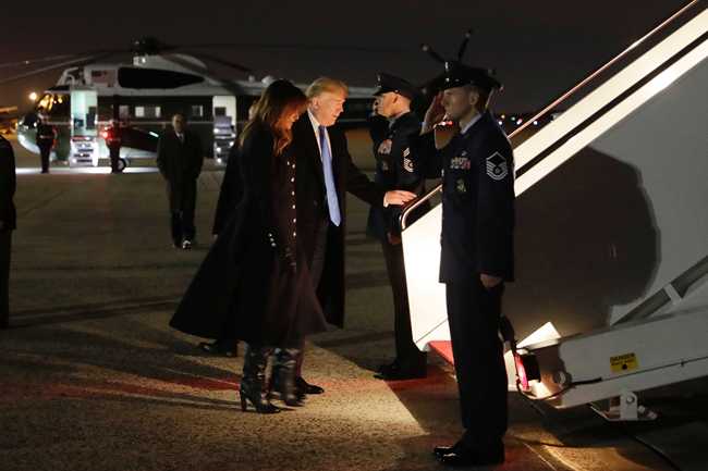 President Donald Trump and first lady Melania Trump, board Air Force One for a trip to Dover Air Force Base to attend a casualty return ceremony for two U.S. service members who died in Afghanistan, Thursday, Nov. 21, 2019, in Andrews Air Force Base, Md. [Photo: AP/ Evan Vucci]