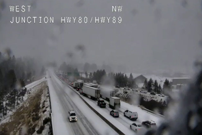 In this still image taken from a Caltrans remote video traffic camera, traffic is stopped along Interstate 80 because of multiple spinouts, Tuesday, Nov. 26, 2019, in Truckee, Calif. [Photo: AP]