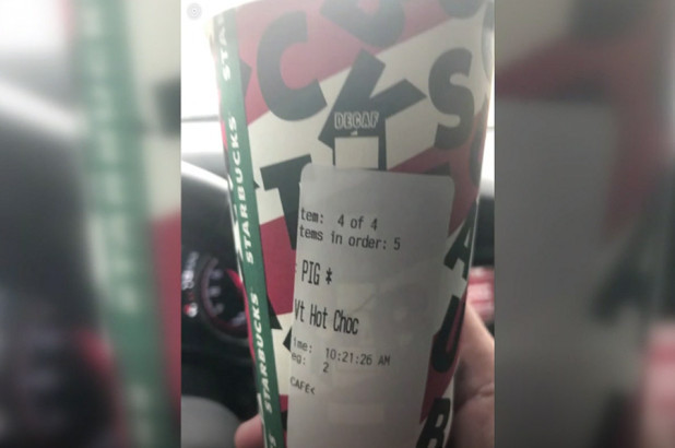 The Starbucks cup with the word "PIG" printed on the label [Screenshot: China Plus]