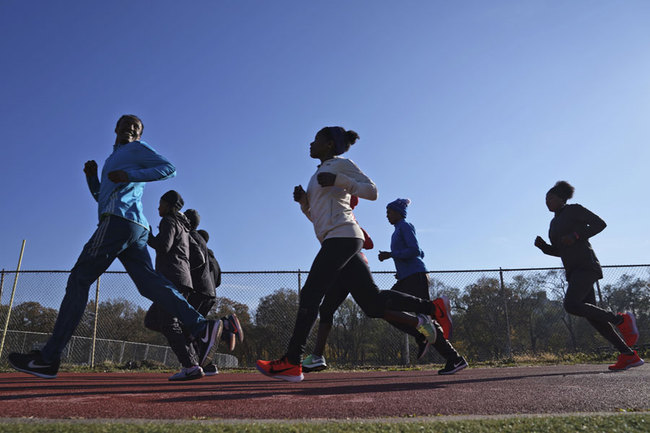 A group of Ethiopian runners works out at Van Cortlandt Park in the Bronx borough of New York, Tuesday, Nov. 26, 2019. Girma Bekele Gebre stunned the elite field at the New York City Marathon by finishing third as a nonelite entrant in November. It was a life-changing performance for the Ethiopian runner, and one made possible because of his involvement with the West Side Runners' Club. Team President Bill Staab has spent four decades helping immigrant runners acquire visas and gain entry to U.S. races, spending nearly $1 million of his own money to cover fees. Bekele Gebre is his greatest success, but not nearly the only runner he's helped. [Photo: AP/Seth Wenig]