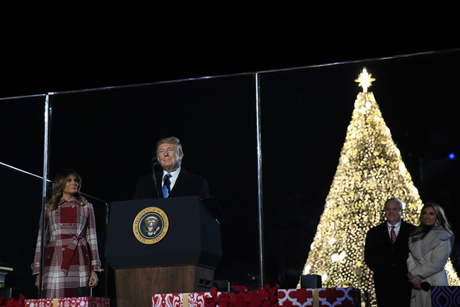 President Donald Trump and first lady Melania Trump attend the National Christmas Tree lighting ceremony at the Ellipse near the White House in Washington, Thursday, Dec. 5, 2019.[Photo: AP/Manuel Balce Ceneta]