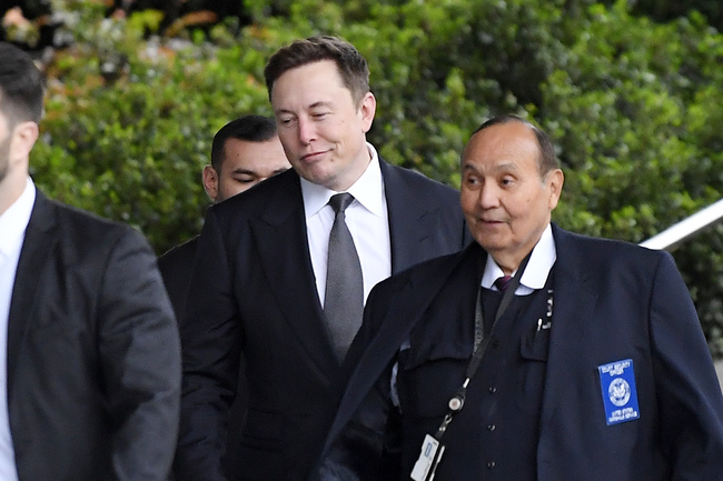 Tesla CEO Elon Musk, second from right, arrives at U.S. District Court Wednesday, Dec. 4, 2019, in Los Angeles. Musk is going on trial for his troublesome tweets in a case pitting the billionaire against a British diver he allegedly dubbed a pedophile. [Photo: AP/Mark J. Terrill]<br>