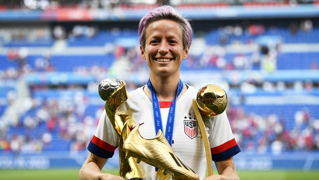 United States' forward Megan Rapinoe poses with the trophies after the France 2019 Women's World Cup football final match between USA and the Netherlands, on July 7, 2019, at the Lyon Stadium in Lyon, central-eastern France. [File Photo: AFP/Franck Fife]