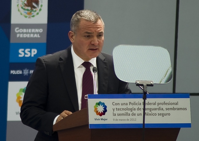 File Photo: Former Mexican Secretary of Public Safety Genaro Garcia Luna speaks during the inauguration of the Federal Police's scientific division in Mexico City,on March 9, 2012. [Photo: AFP/Alfredo ESTRELLA]