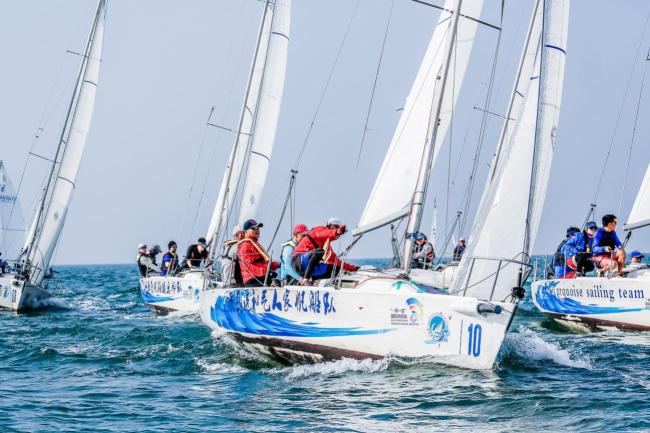Sailing teams compete during the Belt and Road Regatta Beihai station on Dec 13, 2019. [Photo provided to ChinaPlus]