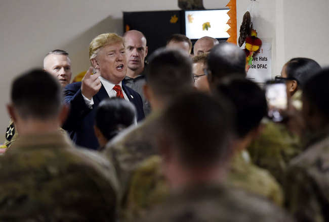 U.S. President Donald Trump greets soldiers after speaking to the troops during a surprise Thanksgiving day visit at Bagram Air Field, on November 28, 2019 in Afghanistan. [Photo: AFP/Olivier Douliery]