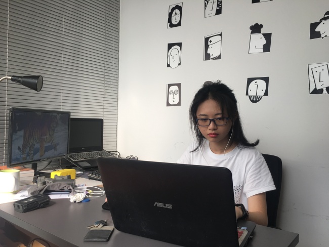 Kun Lot U, a media-savvy student at Huaqiao University works at her studio on November 12th,2019.[Photo: China Plus]  