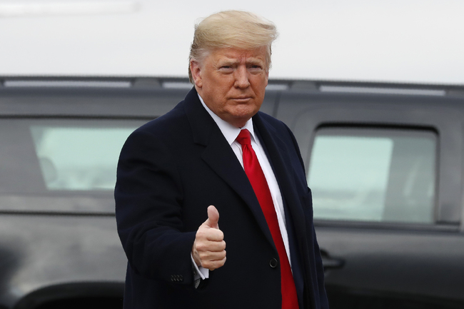 U.S. President Donald Trump makes the thumbs up sign as he exits a motorcade to board Air Force One at Andrews Air Force Base, Md., Saturday, Dec. 14, 2019, en route to Philadelphia to attend the Army-Navy football game. [Photo: AP]