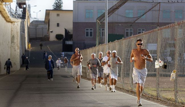 In this Friday, Nov. 22, 2019 file photo, Mark Alan Jarosik, front right, participates in the San Quentin State Prison marathon in San Quentin, Calif. Aged 22 to 72, the competitors are all members of the maximum-security prison’s 1,000 Mile Club and include inmates incarcerated for rape, attempted murder and other charges. [Photo: Santiago Mejia/San Francisco Chronicle via AP]