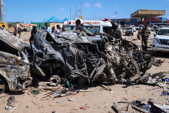 The wreckage of a car that was destroyed during the car bomb attack is seen in Mogadishu, on December 28, 2019. [File photo: AFP/Abdirazak Hussein Farah]