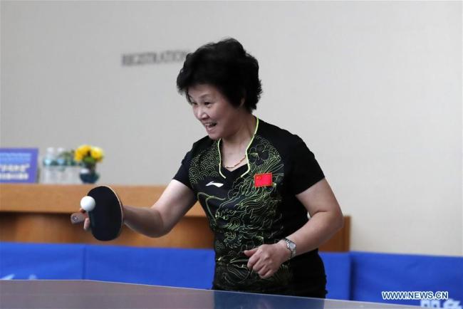 Le champion du monde de tennis de table Zheng Huaiying. 