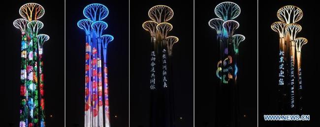 Combinaison de photos prise le 14 mai 2019, montrant une vue nocturne de la Tour olympique à Beijing.